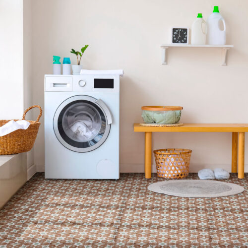 Interior of bathroom with modern washing machine